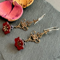 Red Czech glass bell flower earrings on antique brass with sterling silver ear wires.
