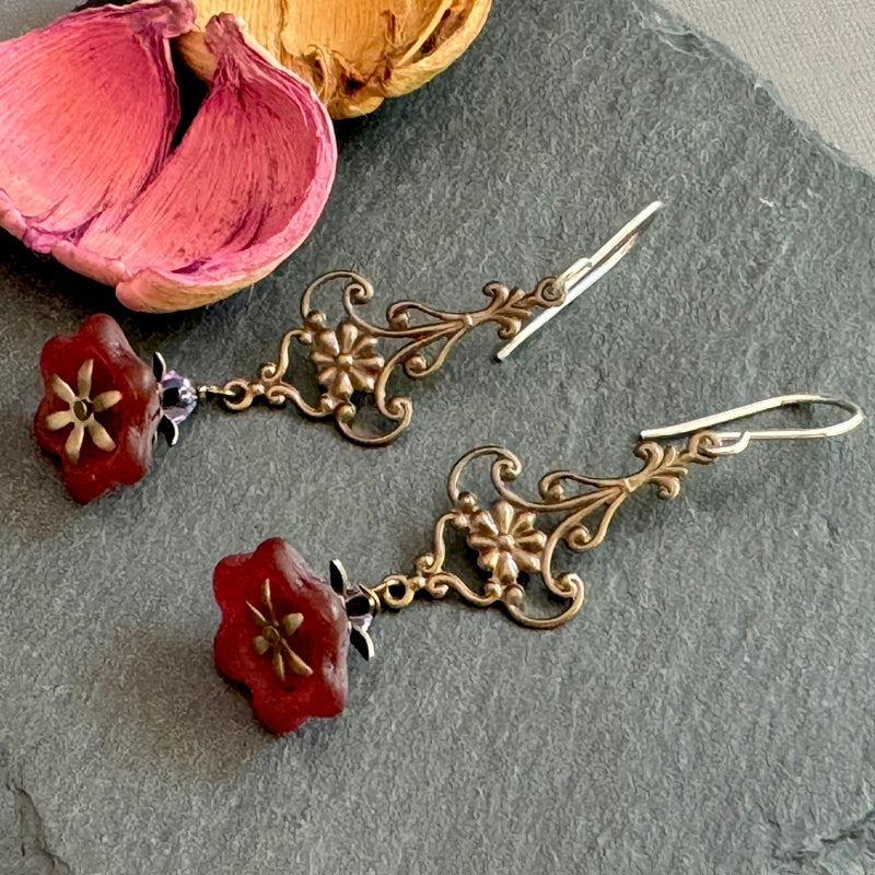 Red Czech glass bell flower earrings on antique brass with sterling silver ear wires.