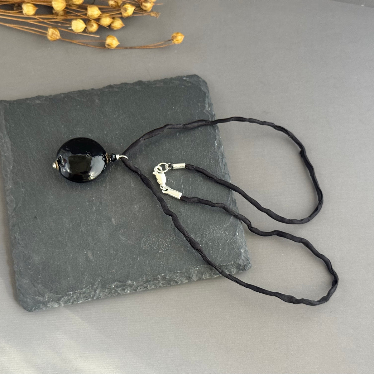 Murano Glass Black Disc Shape on Silk Cord in Sterling Silver