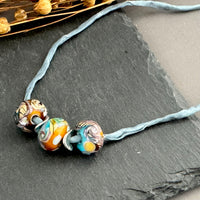 Handmade Grace Ma Blue and Gold Swirl Lamp Work Bead Necklace