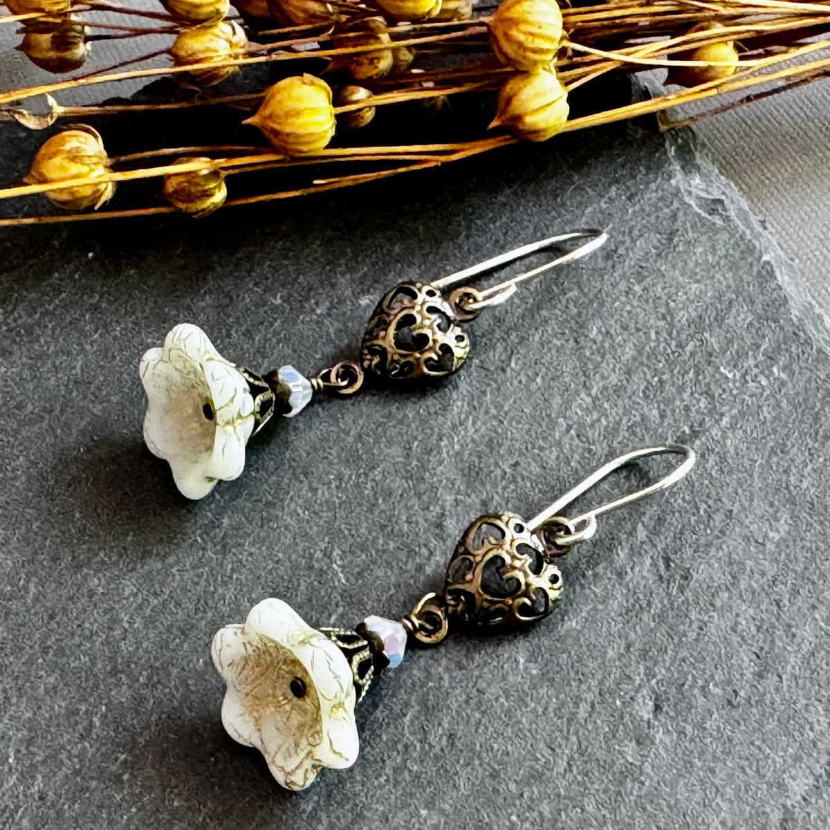 White Czech Glass Bell Flower Earrings with Antique Brass Heart Components in Sterling Silver