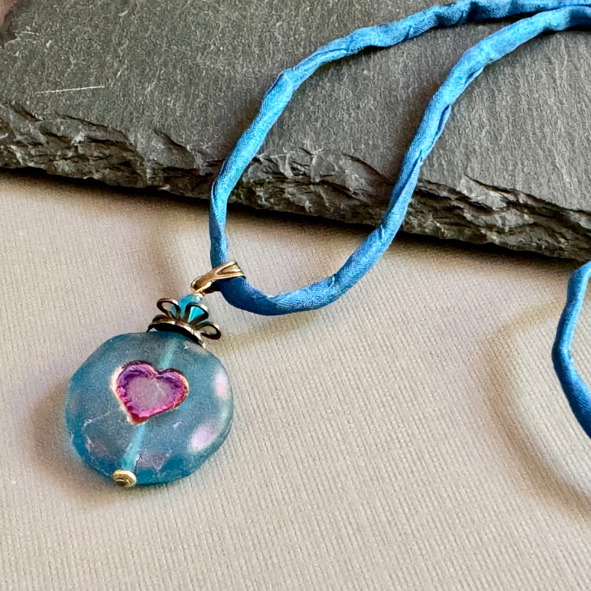Royal Blue Czech Glass Heart Pendant Necklace on Silk Cord in Antique Brass