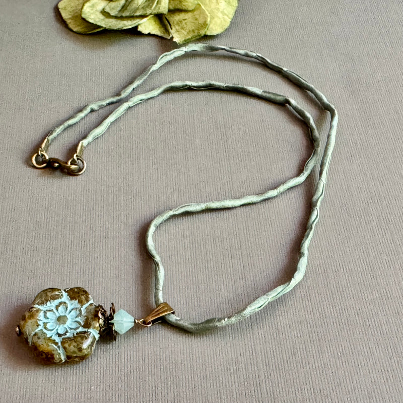 Clear Picasso and Blue Czech Glass Flower Pendant Necklace on Silk Cord in Antique Brass