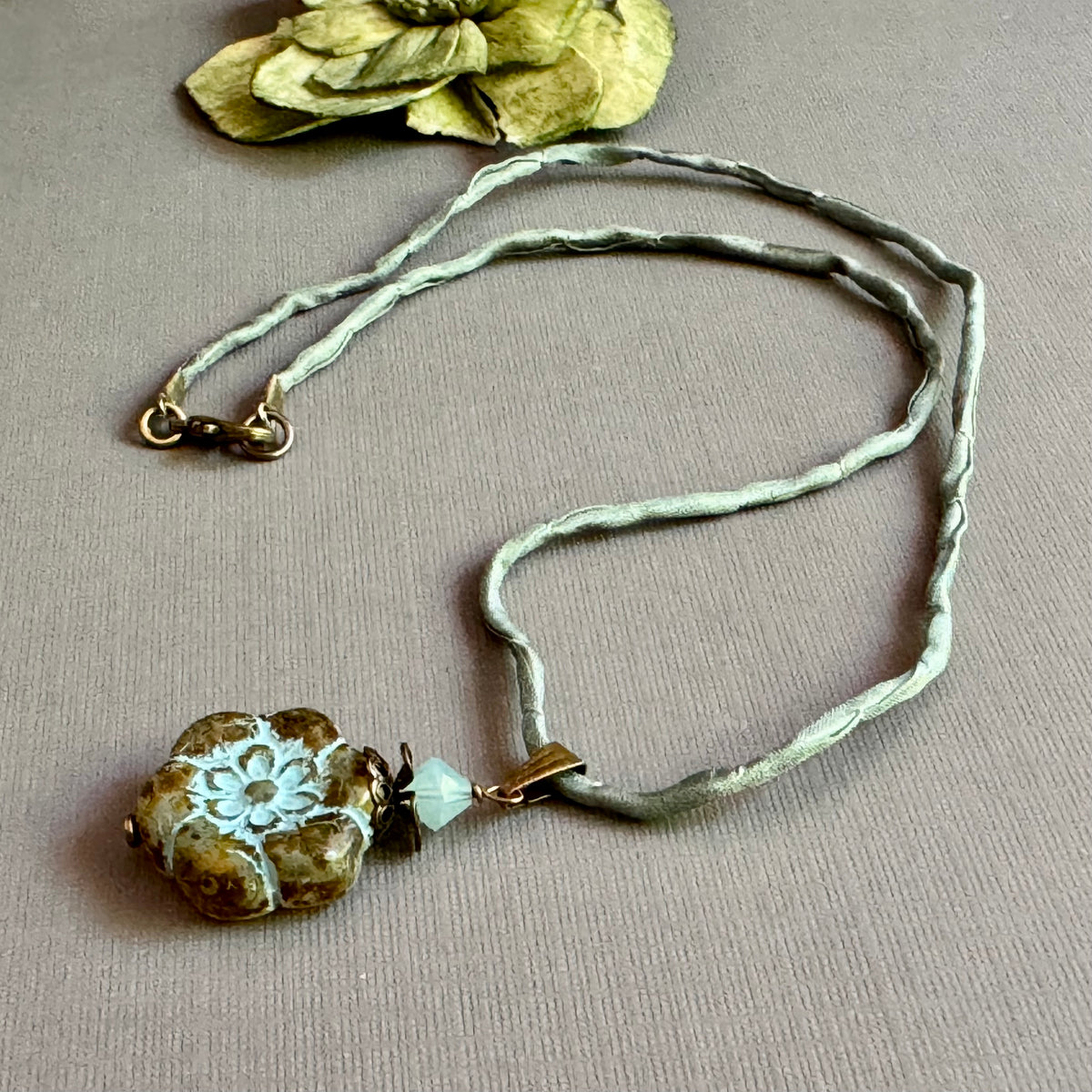 Clear Picasso and Blue Czech Glass Flower Pendant Necklace on Silk Cord in Antique Brass