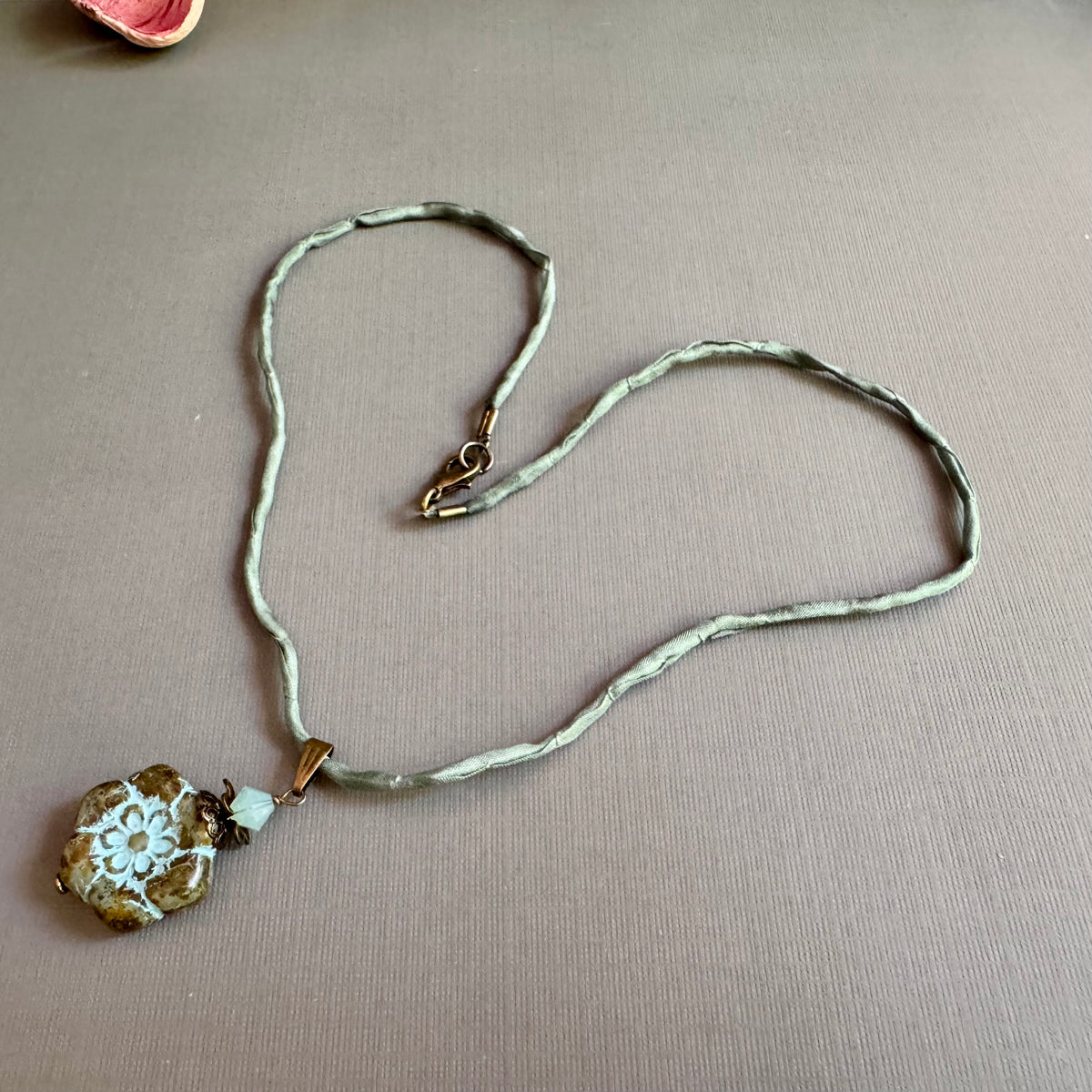Clear Picasso and Blue Czech Glass Flower Pendant Necklace on Silk Cord in Antique Brass
