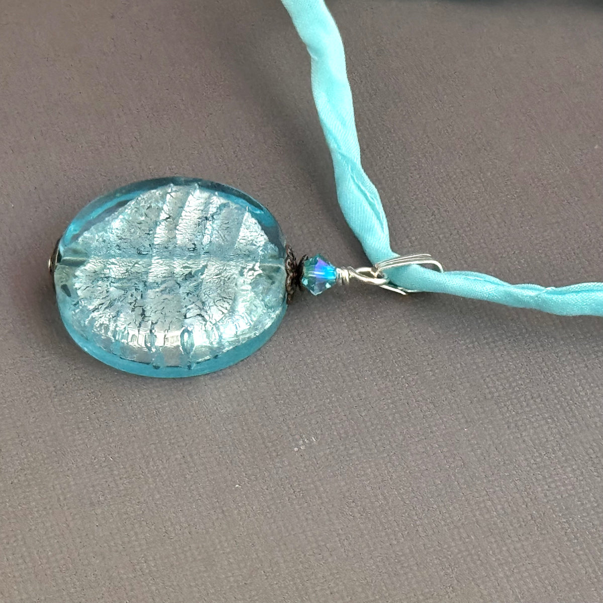 Murano Glass Large Pale Blue Coin Shape on Silk Cord