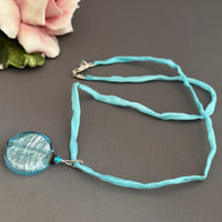 Murano Glass Large Pale Blue Coin Shape on Silk Cord