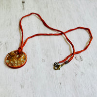 Handmade Orange Porcelain Fern Pendant on Silk Cord