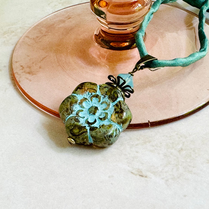 Clear Picasso and Blue Czech Glass Flower Pendant Necklace on Silk Cord in Antique Brass