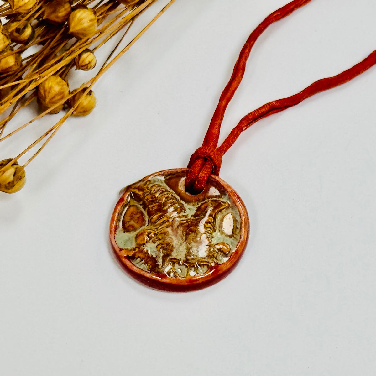 Handmade Orange Porcelain Fern Pendant on Silk Cord