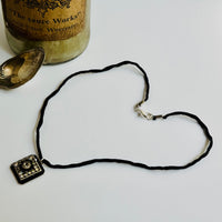 Black and Clear Swarovski Crystal Filigree Pendant in Metal Alloy