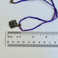 Amethyst and Sapphire Swarovski Crystal Filigree Pendant in Antique Brass