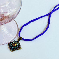 Amethyst and Sapphire Swarovski Crystal Filigree Pendant in Antique Brass