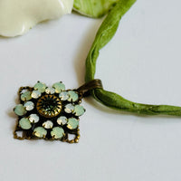 Light Green Swarovski Crystal Filigree Pendant in Antique Brass