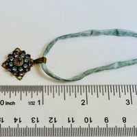 Amethyst and Sapphire Swarovski Crystal Filigree Pendant in Antique Brass