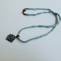 Amethyst and Sapphire Swarovski Crystal Filigree Pendant in Antique Brass