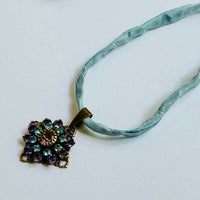 Amethyst and Sapphire Swarovski Crystal Filigree Pendant in Antique Brass