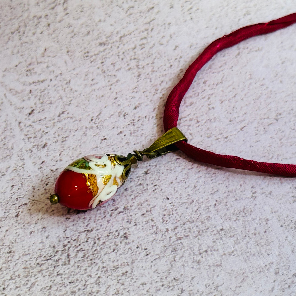 Red Oval Wedding Cake Necklace on Red Silk Cord