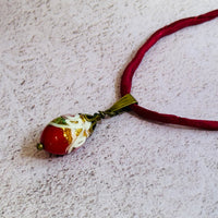 Red Oval Wedding Cake Necklace on Red Silk Cord