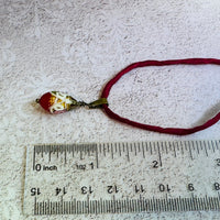 Red Oval Wedding Cake Necklace on Red Silk Cord