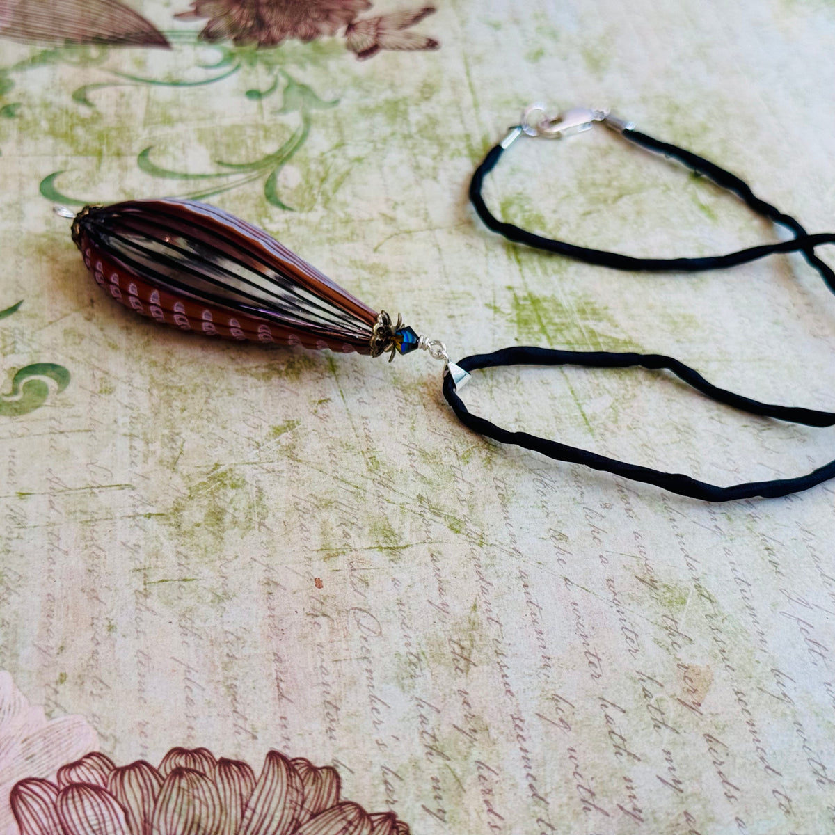 Black and Brown Murano Glass Sculpted Teardrop Bead on Silk Cord