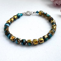 Czech Glass Sky Blue and Gold Cathedral Bracelet in Sterling Silver