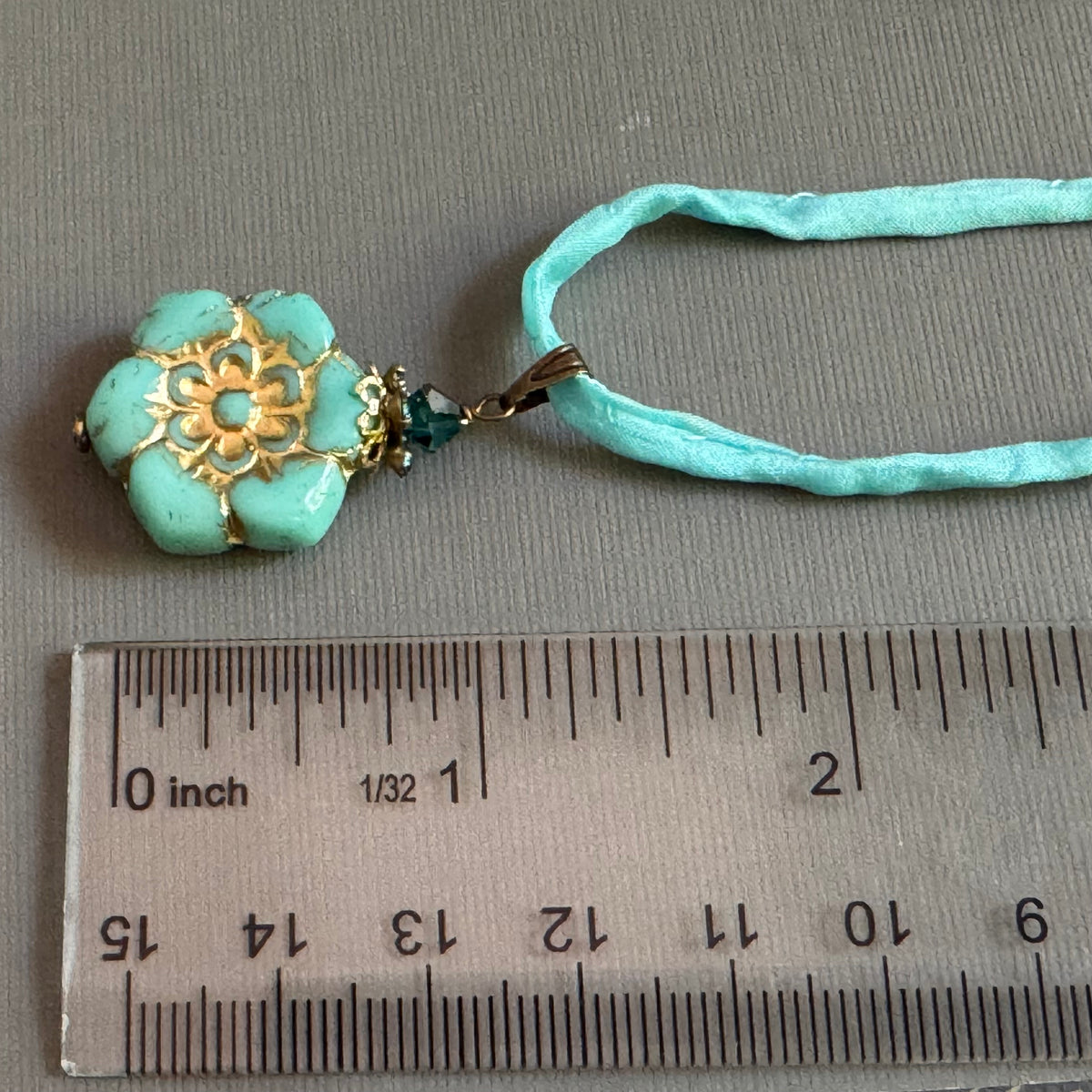 Light Teal Czech Glass Flower Pendant Necklace on Silk Cord in Antique Brass